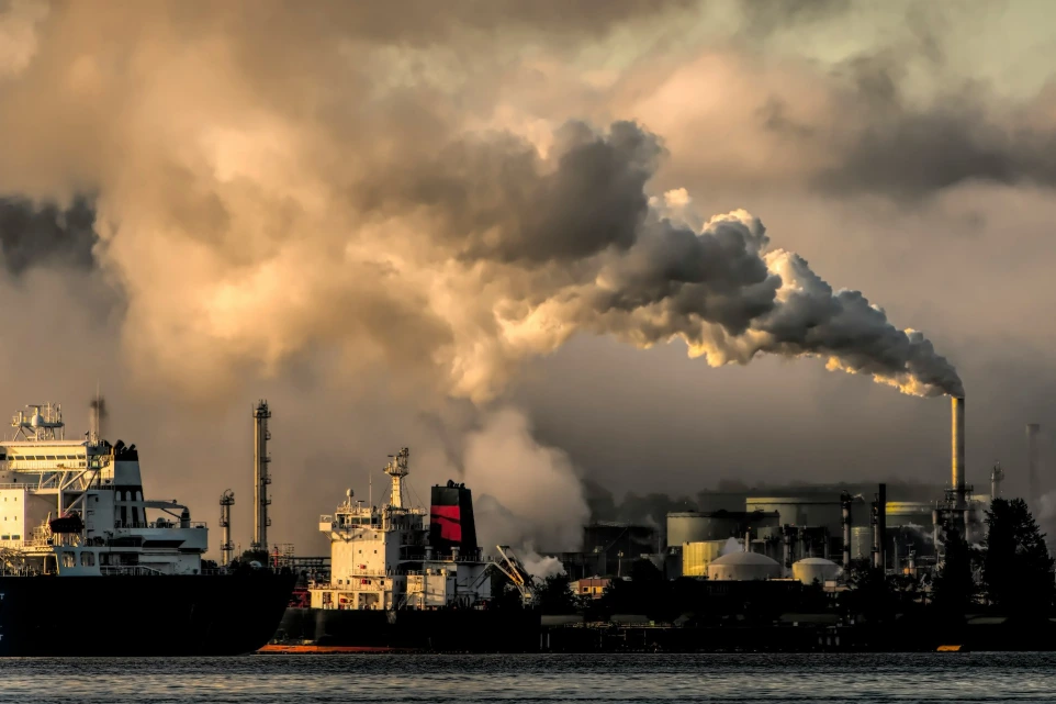 industrial harbor with smokestack pollution